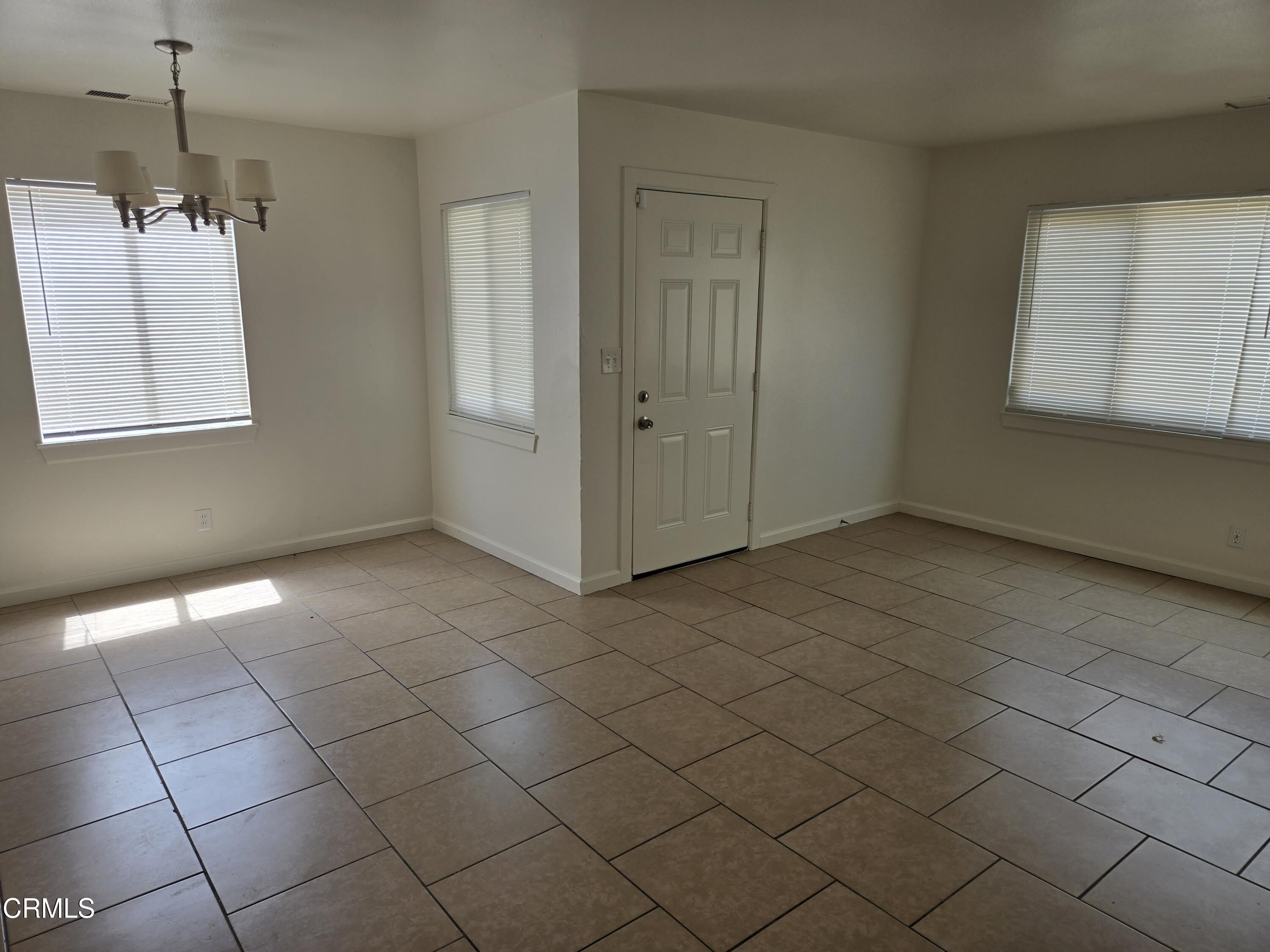 44226 2nd Street East Lancaster, CA 93535 - Photo 9 of 12 a view of an empty room with a window