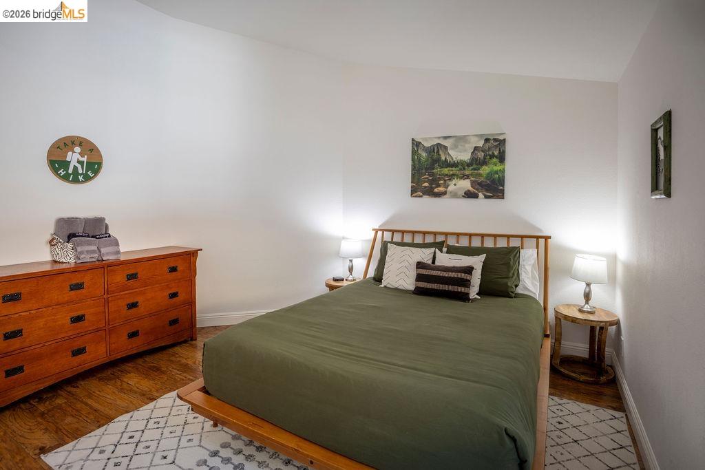 20828 Ferretti Road Groveland, CA 95321 - Photo 12 of 60 Bedroom featuring dark wood finished floors and baseboards
