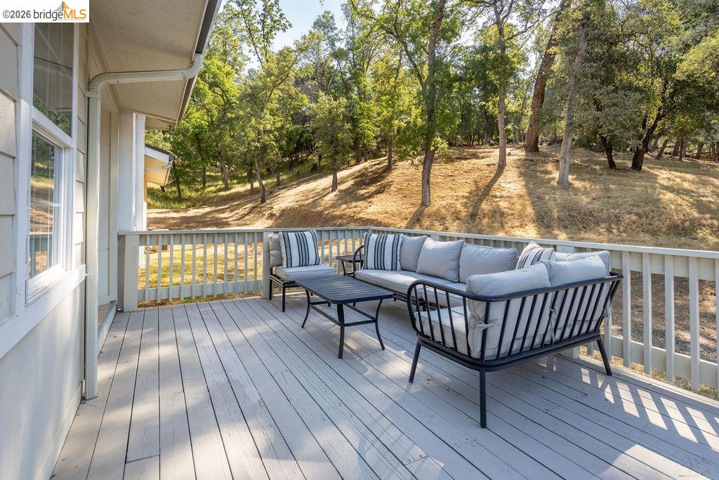 20828 Ferretti Road Groveland, CA 95321 - Photo 15 of 60 Deck featuring an outdoor hangout area and view of scattered trees