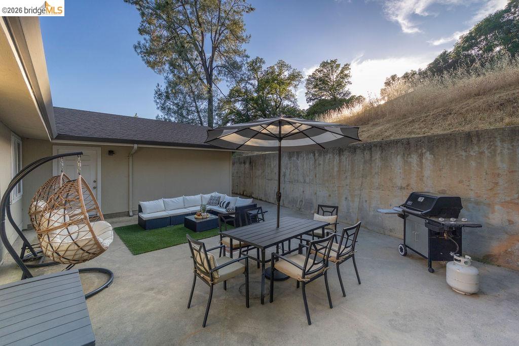 20828 Ferretti Road Groveland, CA 95321 - Photo 31 of 60 Fenced backyard featuring a patio, area for grilling, and an outdoor living / dining area