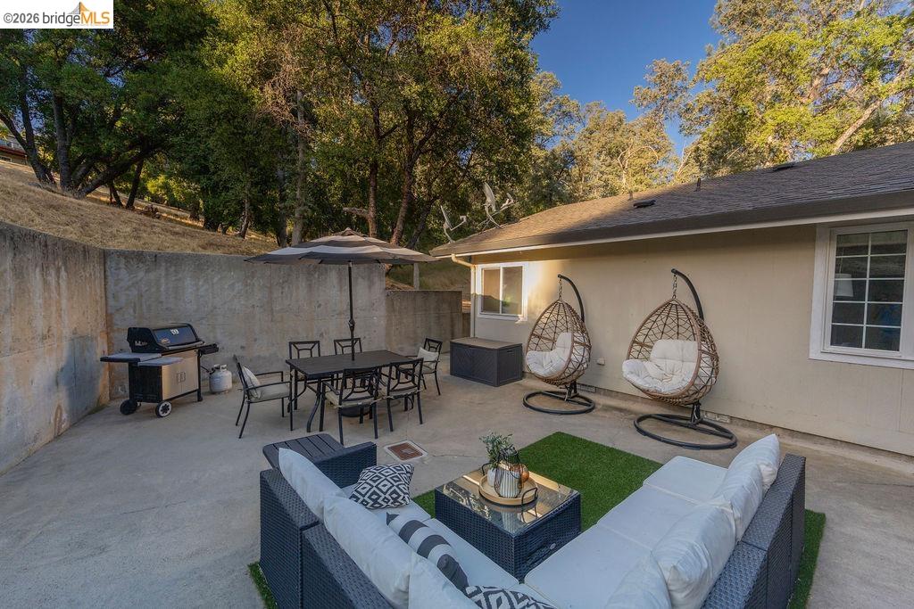 20828 Ferretti Road Groveland, CA 95321 - Photo 35 of 60 Fenced backyard featuring an outdoor living / dining area, area for grilling, and a patio area