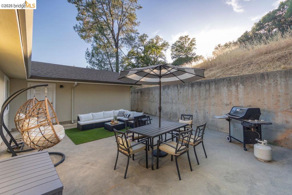 20828 Ferretti Road Groveland, CA 95321 - Photo 4 of 60 Fenced backyard with outdoor lounge area, grilling area, and a patio area