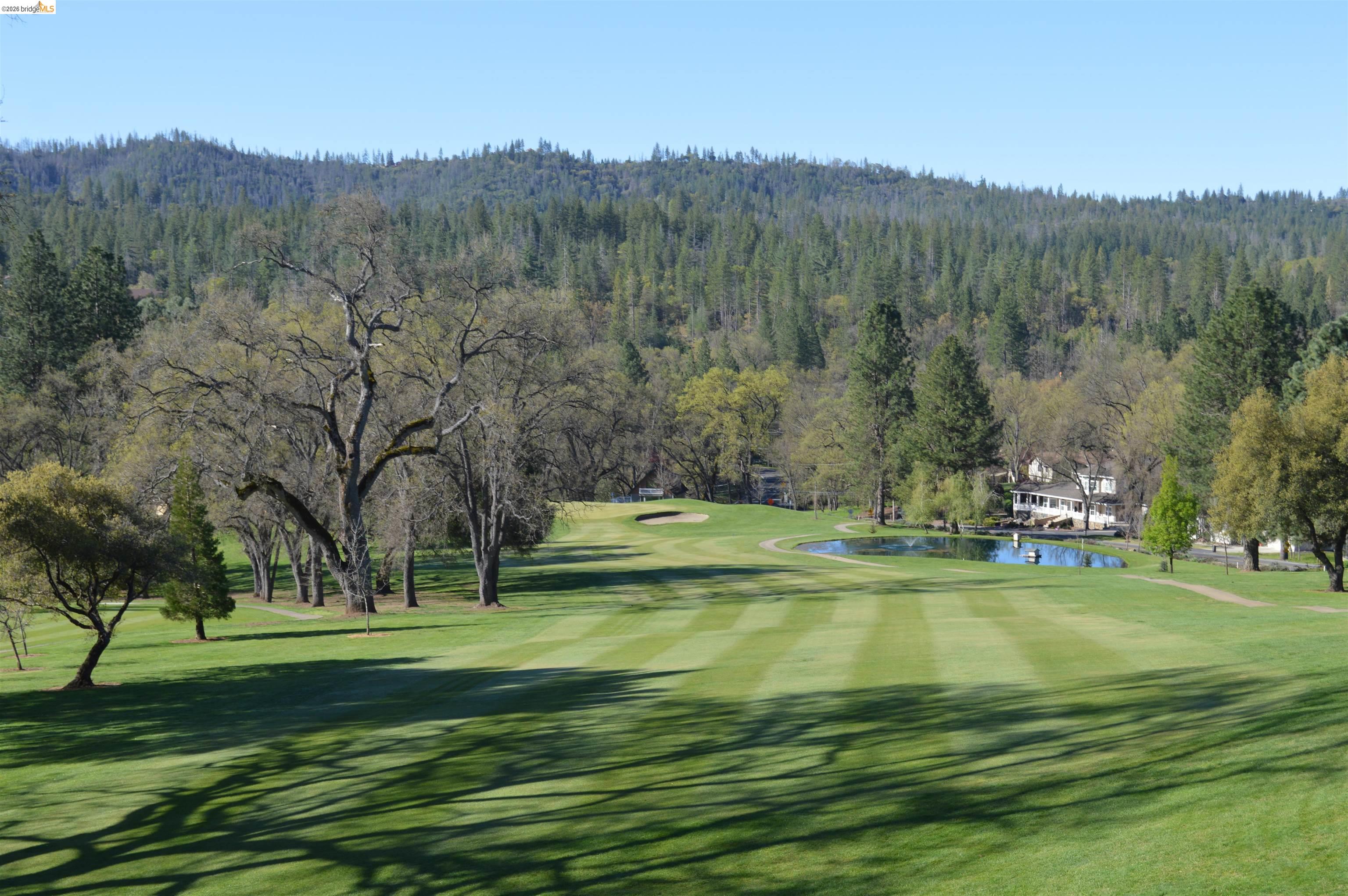 20828 Ferretti Road Groveland, CA 95321 - Photo 47 of 60 Surrounding community with view of golf course, a forest view, and a water view