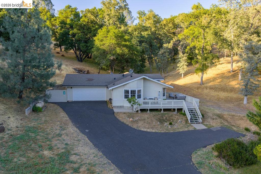 20828 Ferretti Road Groveland, CA 95321 - Photo 56 of 60 View of front of home with a deck and asphalt driveway
