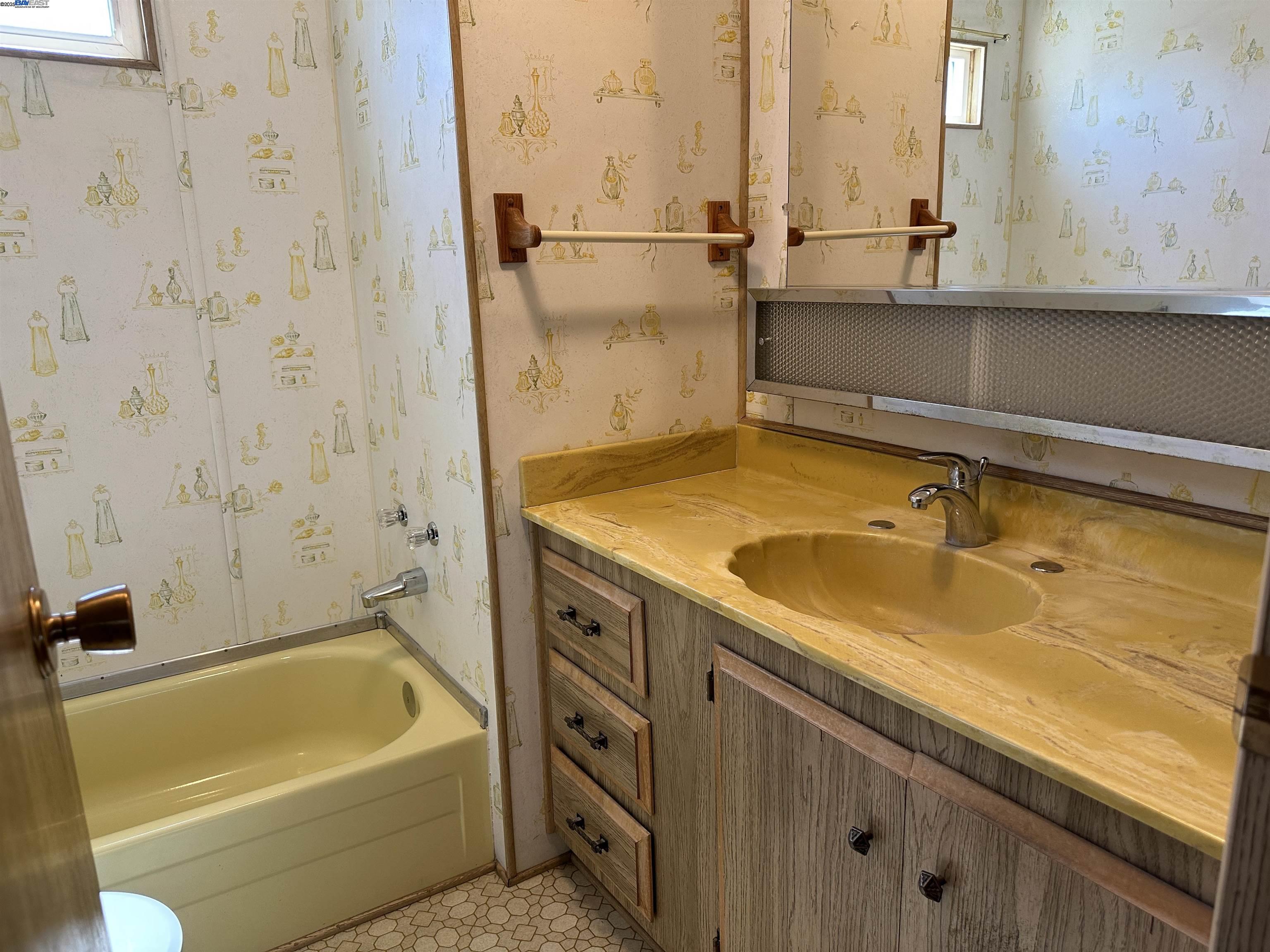 711 Old Canyon Road, Unit 77 Fremont, CA 94538 - Photo 21 of 39 a bathroom with a sink and a bathtub
