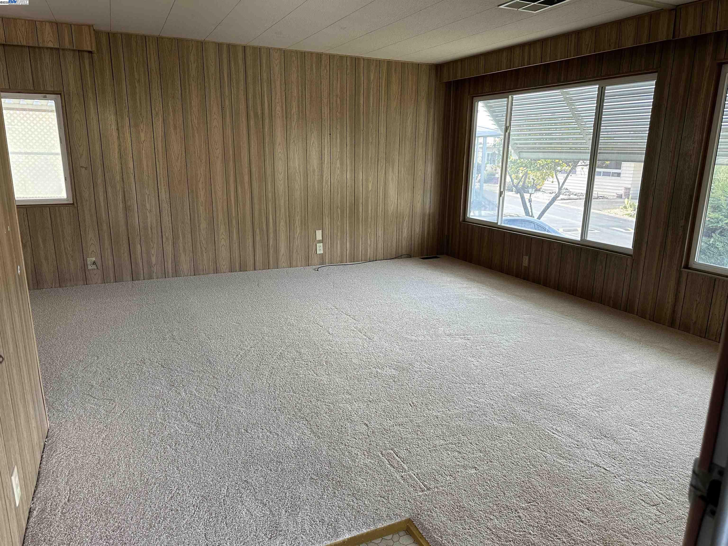 711 Old Canyon Road, Unit 77 Fremont, CA 94538 - Photo 9 of 39 an empty room with windows