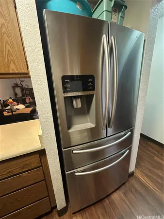 a close view of stove and refrigerator