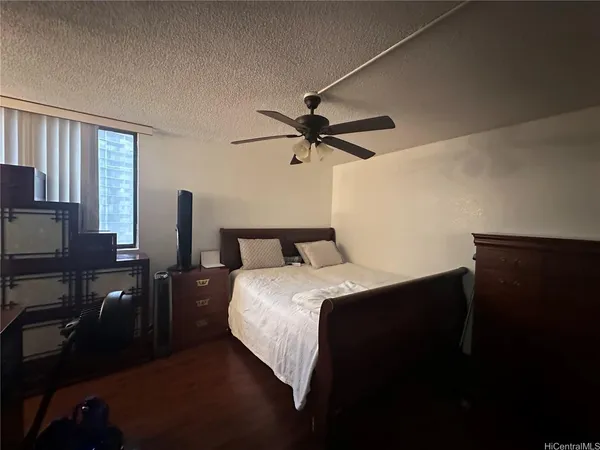 a bedroom with bed and window