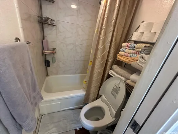 a bathroom with a sink a toilet and bathtub