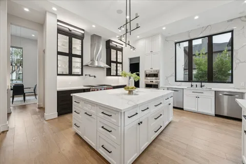 a kitchen with cabinets and appliances