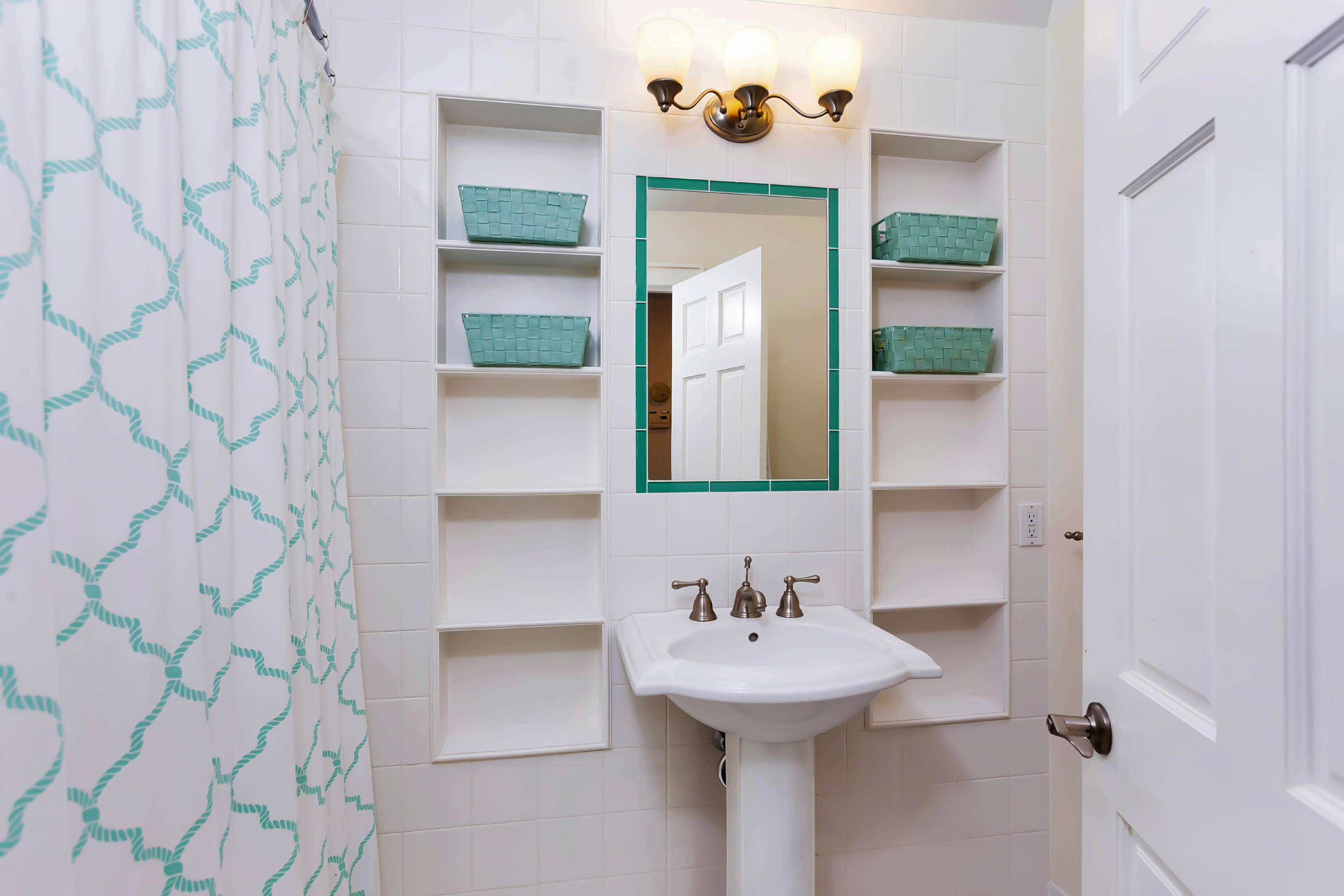 279 Silvermine Road New Canaan, CT 06840 - Photo 20 of 24 a bathroom with a sink and mirror