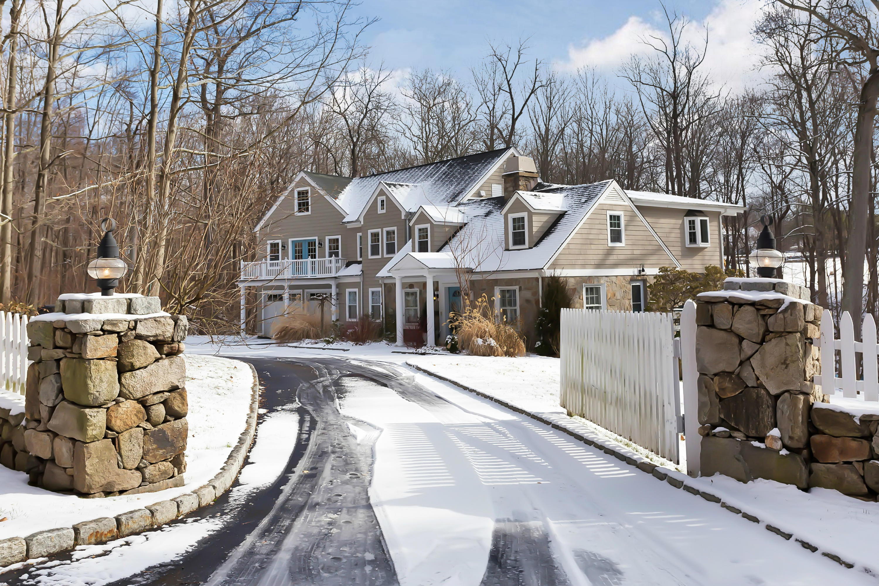 279 Silvermine Road New Canaan, CT 06840 - Photo 2 of 24 a view of a white house with a large trees
