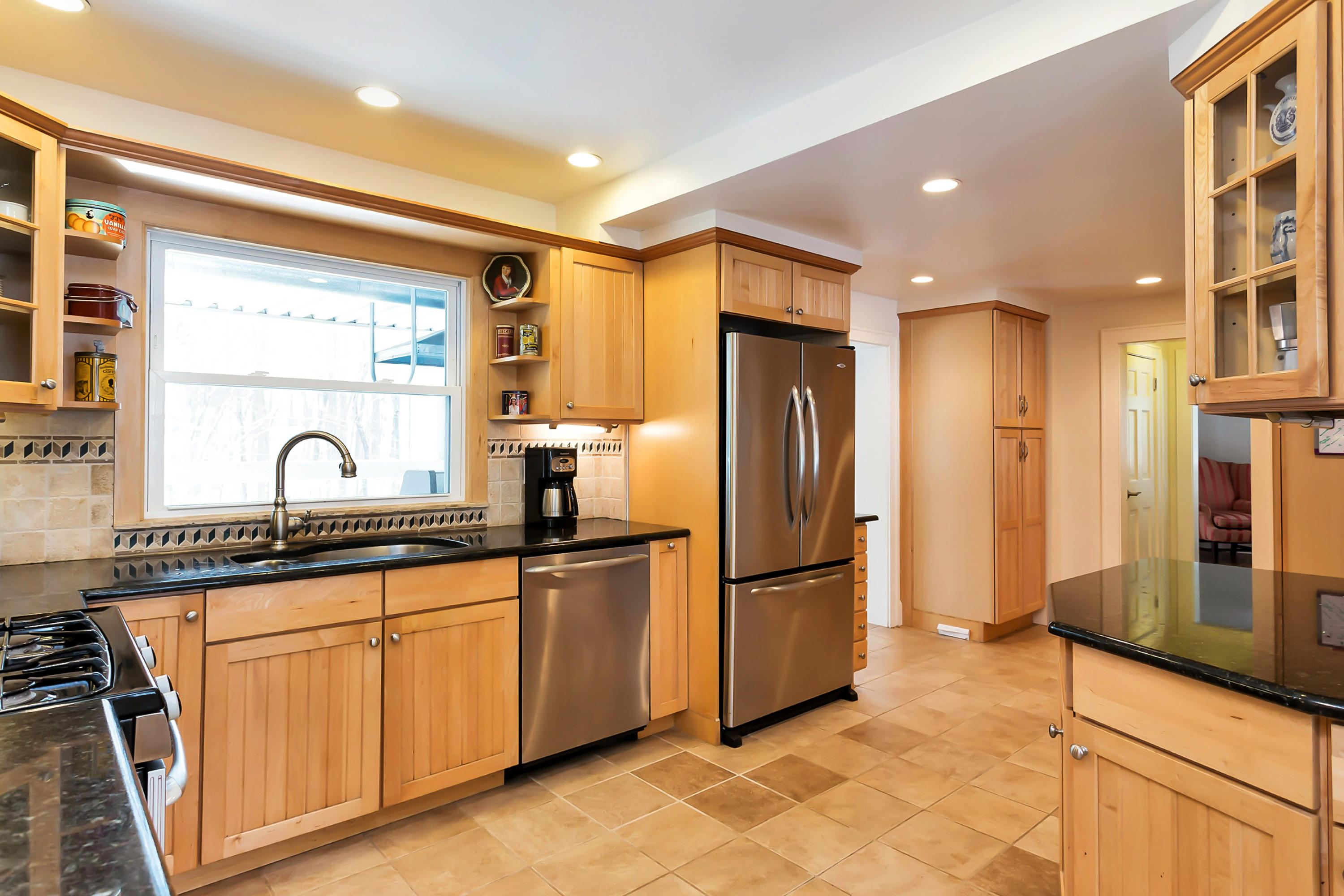 279 Silvermine Road New Canaan, CT 06840 - Photo 9 of 24 a kitchen with stainless steel appliances granite countertop a refrigerator and a sink