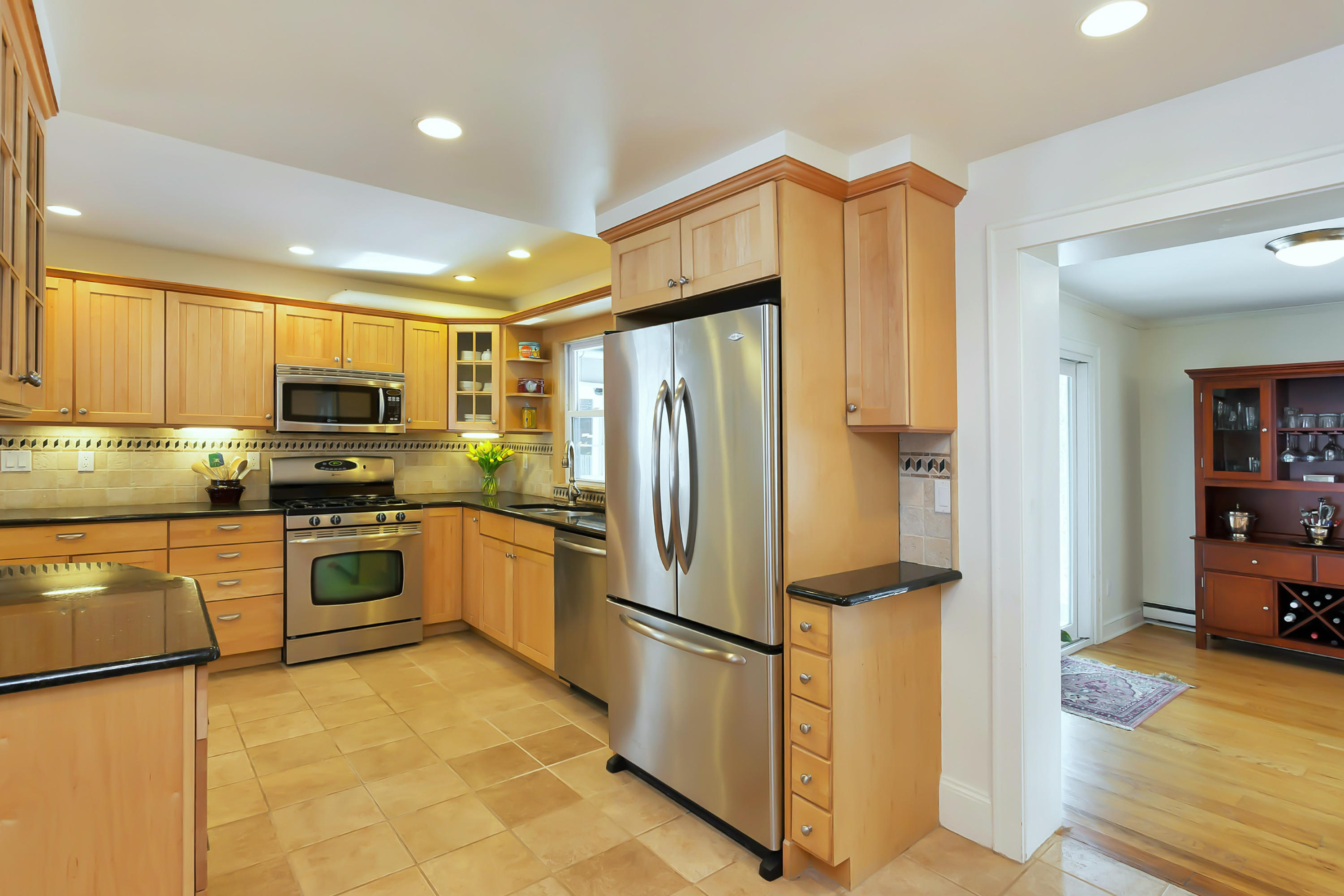 279 Silvermine Road New Canaan, CT 06840 - Photo 10 of 24 a kitchen with stainless steel appliances granite countertop a refrigerator sink and cabinets