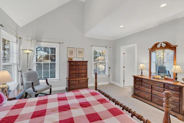 a spacious bathroom with a shower sink and mirror