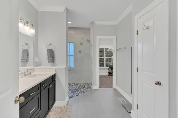 a spacious bathroom with a double vanity sink mirror and double