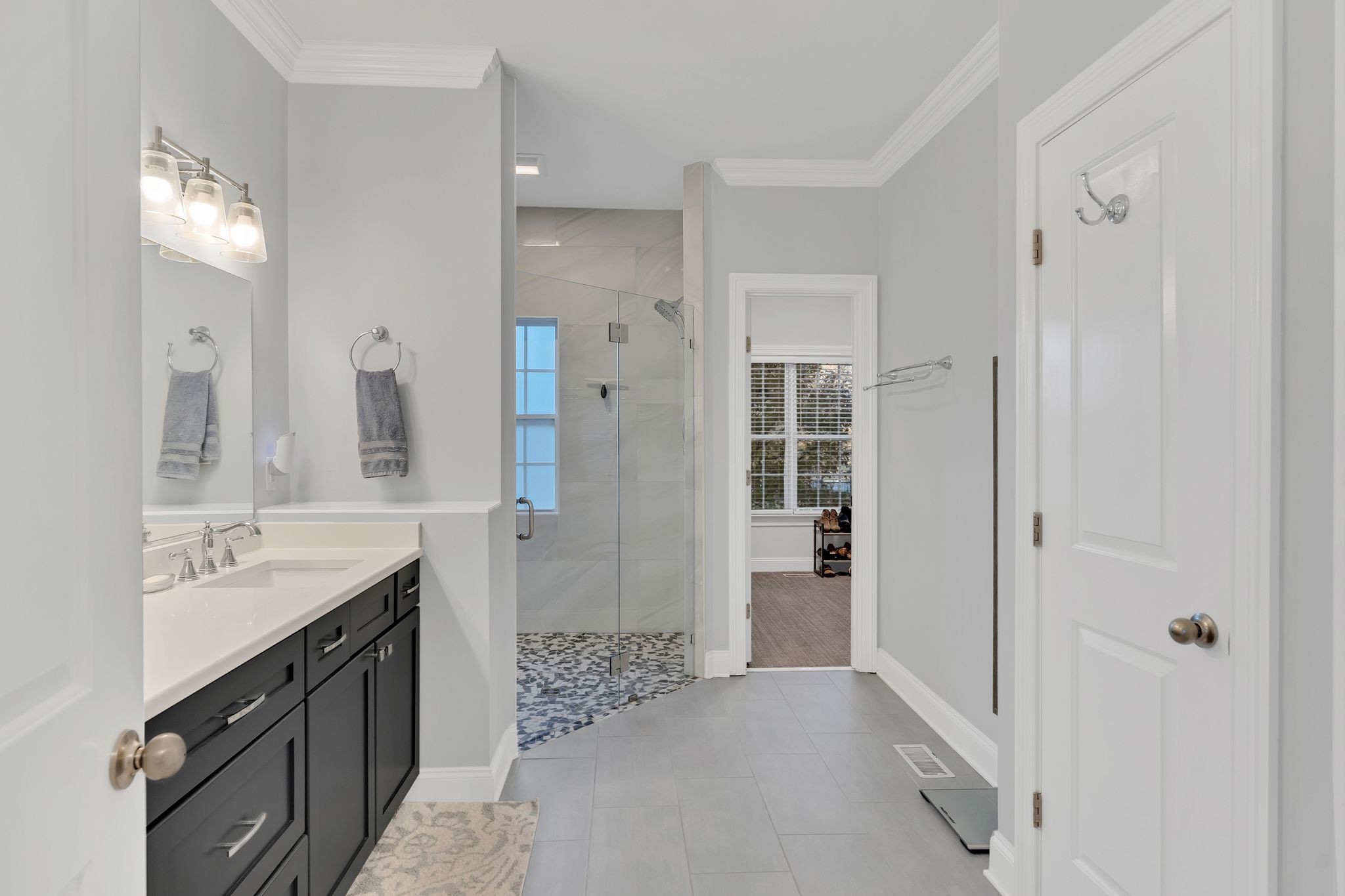 7315 McCormick Drive Fairview, TN 37062 - Photo 23 of 56 a spacious bathroom with a shower sink and mirror