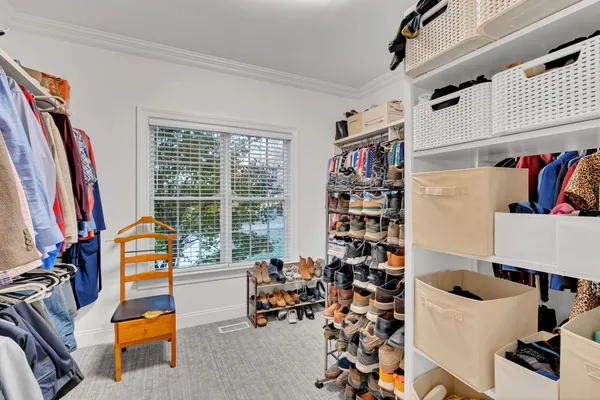 a utility room with cabinets washer and dryer