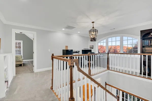 a view of a livingroom with workspace and furniture