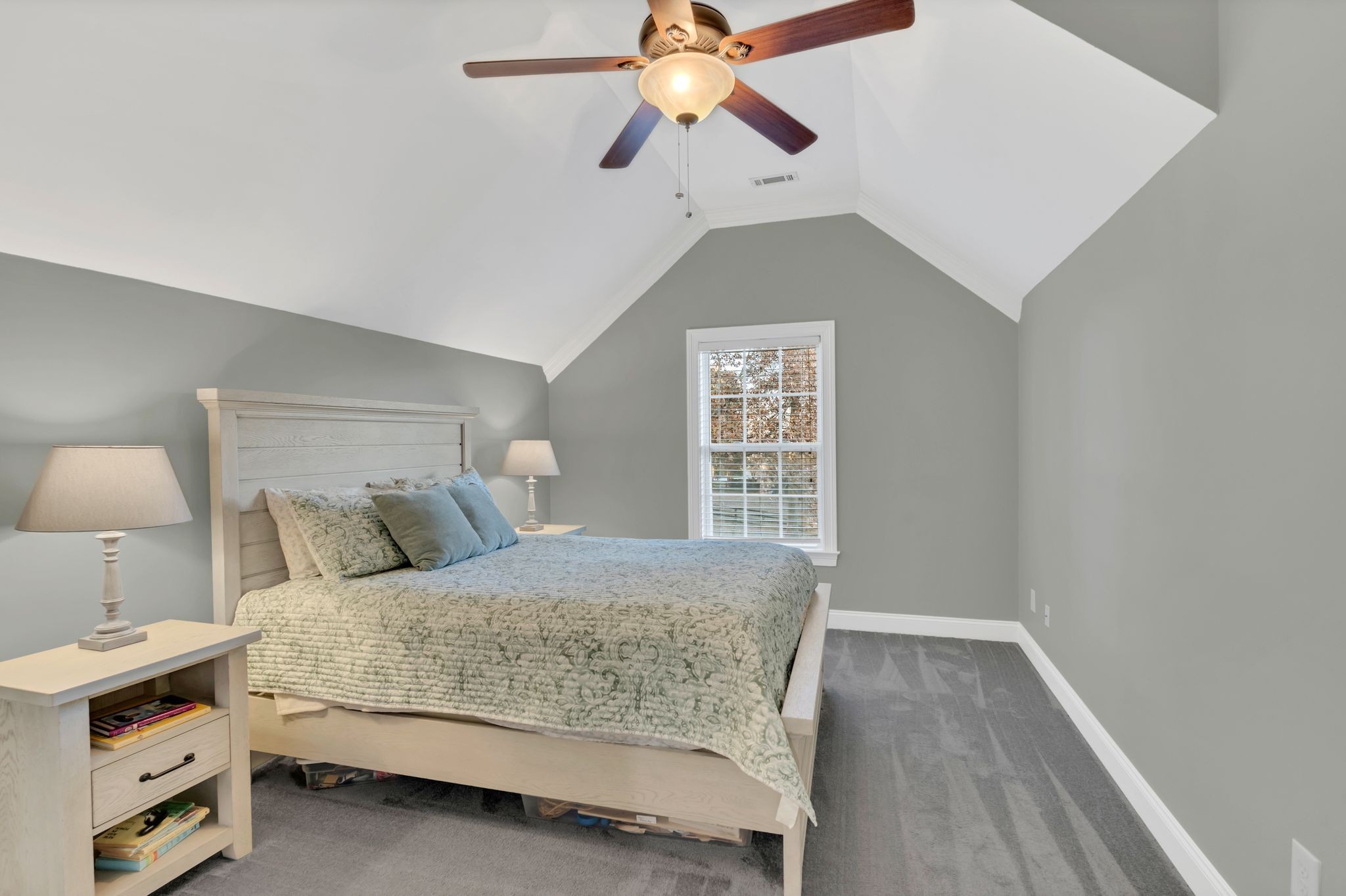 7315 McCormick Drive Fairview, TN 37062 - Photo 34 of 56 a bedroom with a bed chandelier and a window