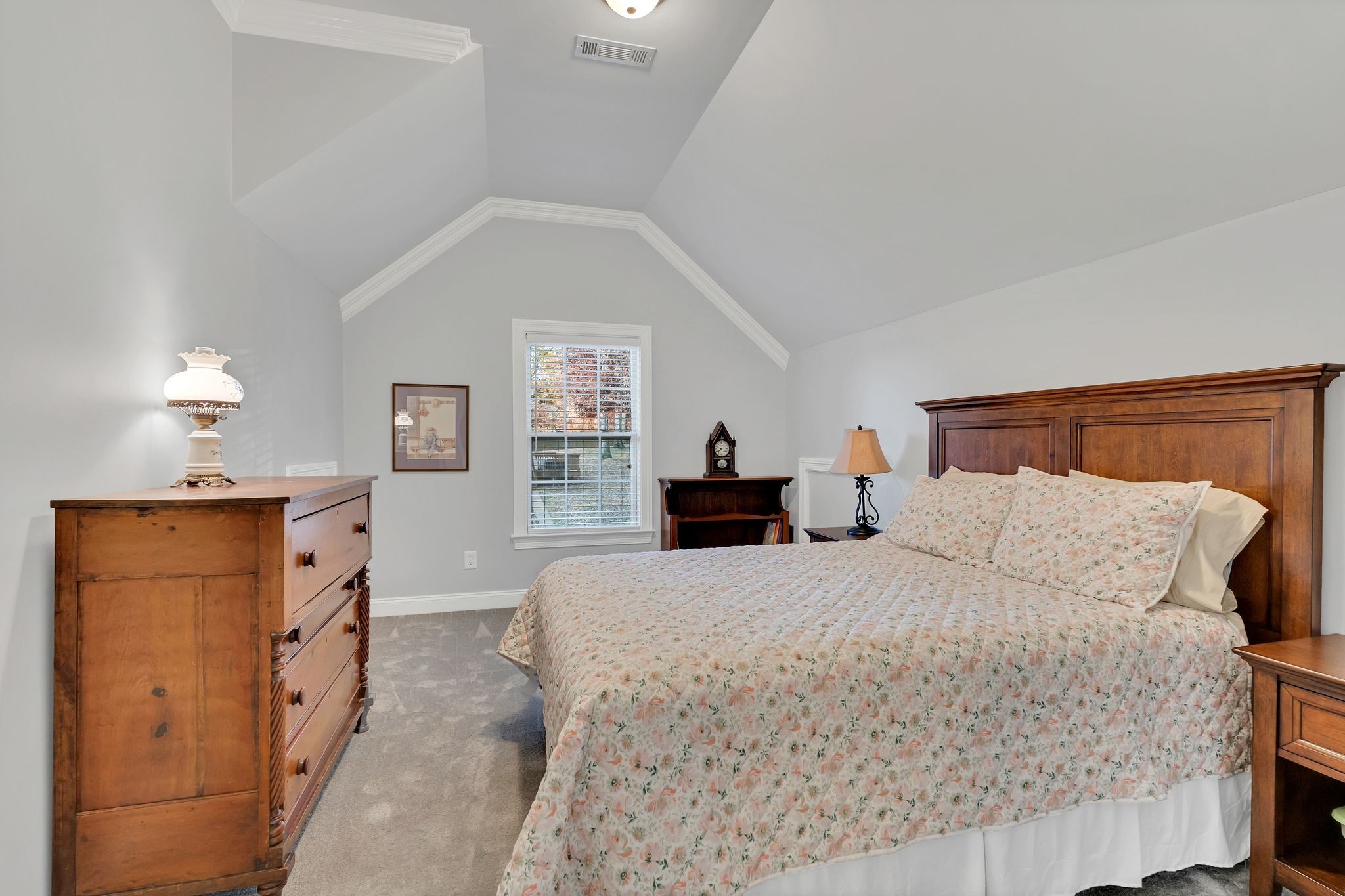 7315 McCormick Drive Fairview, TN 37062 - Photo 38 of 56 a bedroom with a large bed and a dresser
