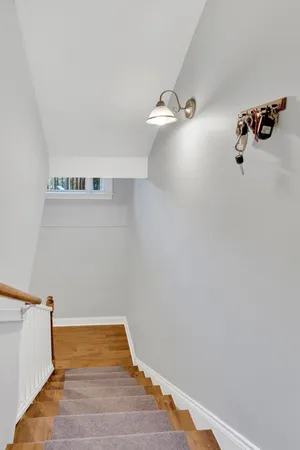 a view of a chairs and table in the balcony