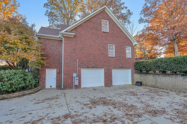 a view of a yard with wooden fence and a bench