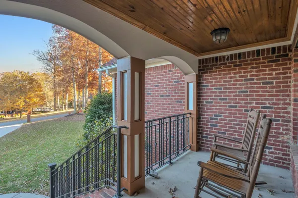 a living room with furniture and stairs