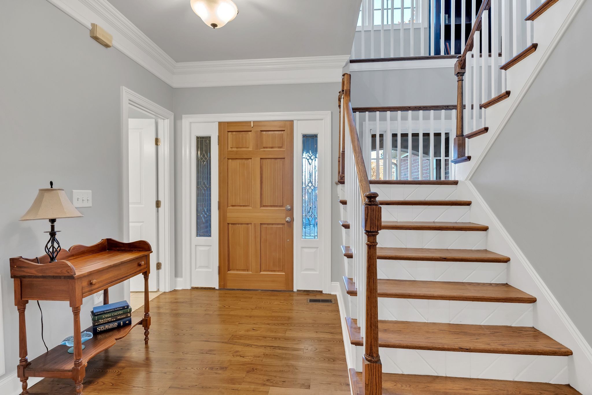 7315 McCormick Drive Fairview, TN 37062 - Photo 7 of 56 a view of entryway and hall with wooden floor