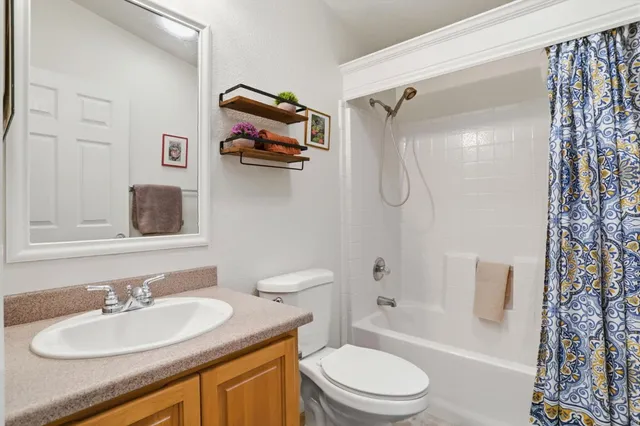 a bathroom with a sink toilet tub and shower
