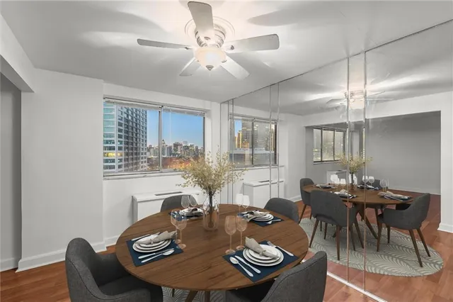 a view of a dining room with furniture window and outside view