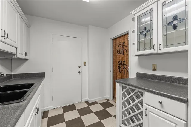 a kitchen with stainless steel appliances a stove a sink and a refrigerator