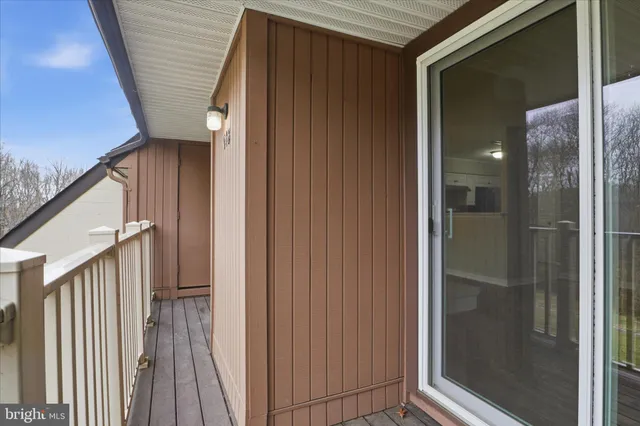 a view of room with window and ceiling fan