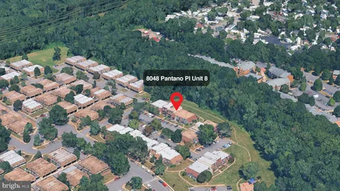 a front view of a house with entryway and a yard