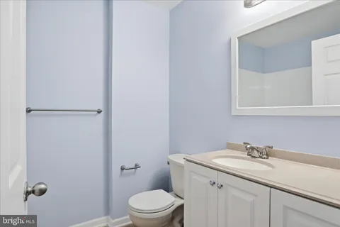 a sign that is sitting on a wooden floor