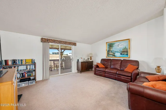 a bedroom with furniture and a book shelf
