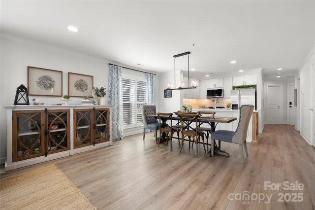 a view of a livingroom with furniture and mirror