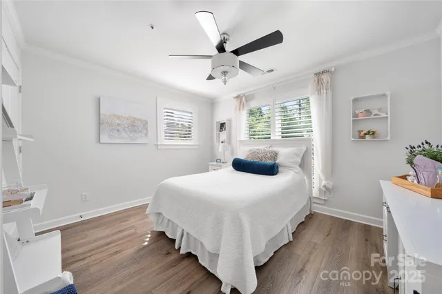 a bedroom with a bed and a view of kitchen