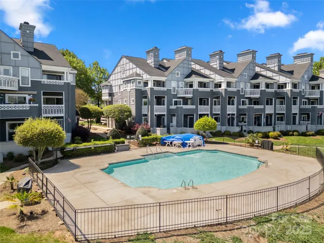 an aerial view of a house with a lake view