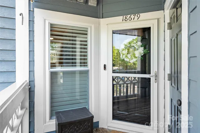a view of a door and a window
