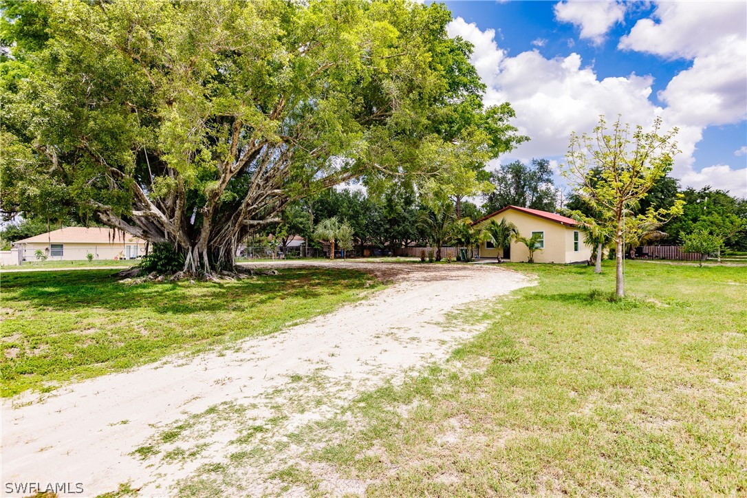2502 Lake Trafford Road Immokalee, FL 34142 - Photo 1 of 15 a view of a house with a yard