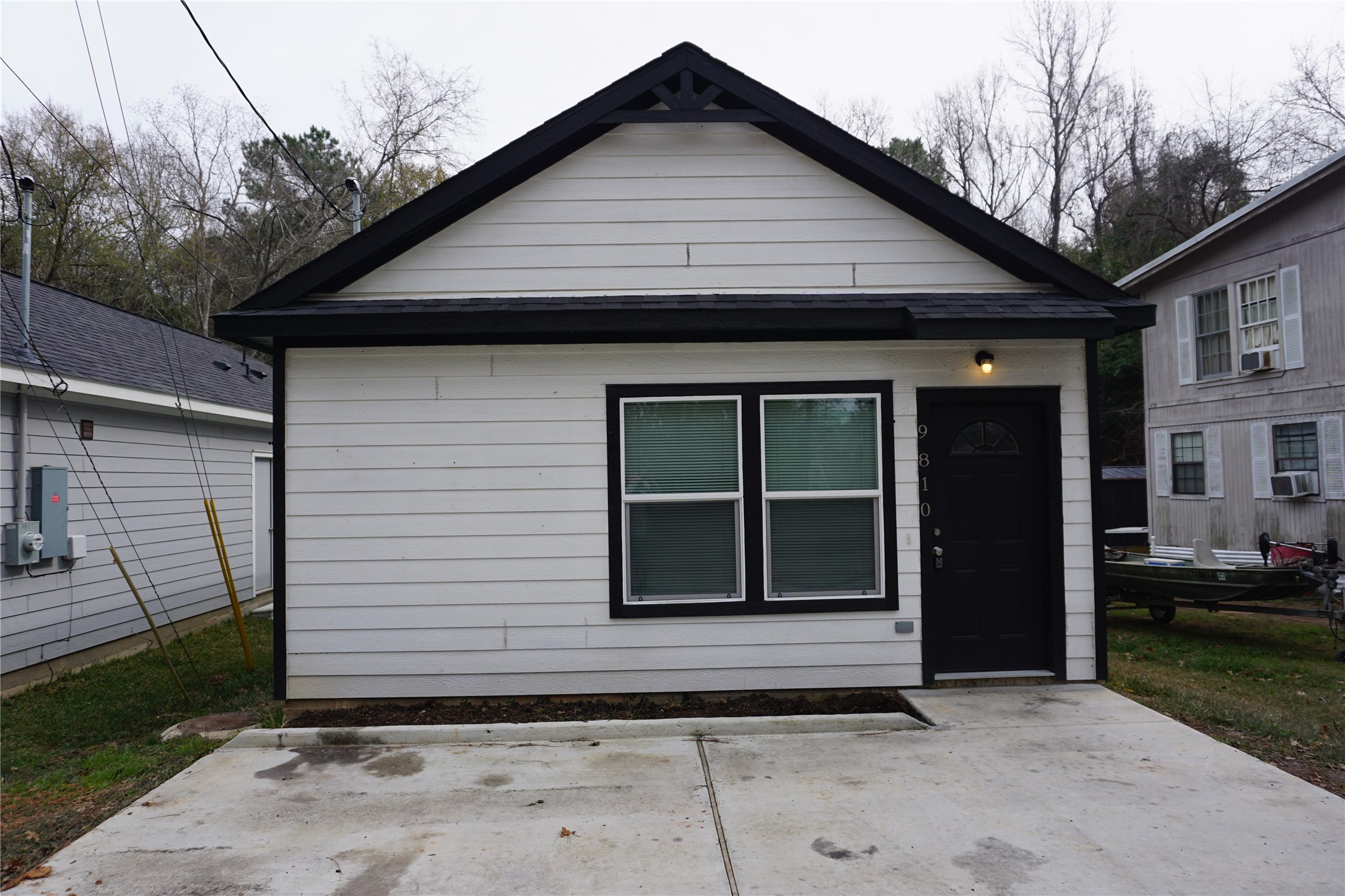 9810 Arbor Oak Willis, TX 77318 - Photo 1 of 43 a front view of a house with a yard