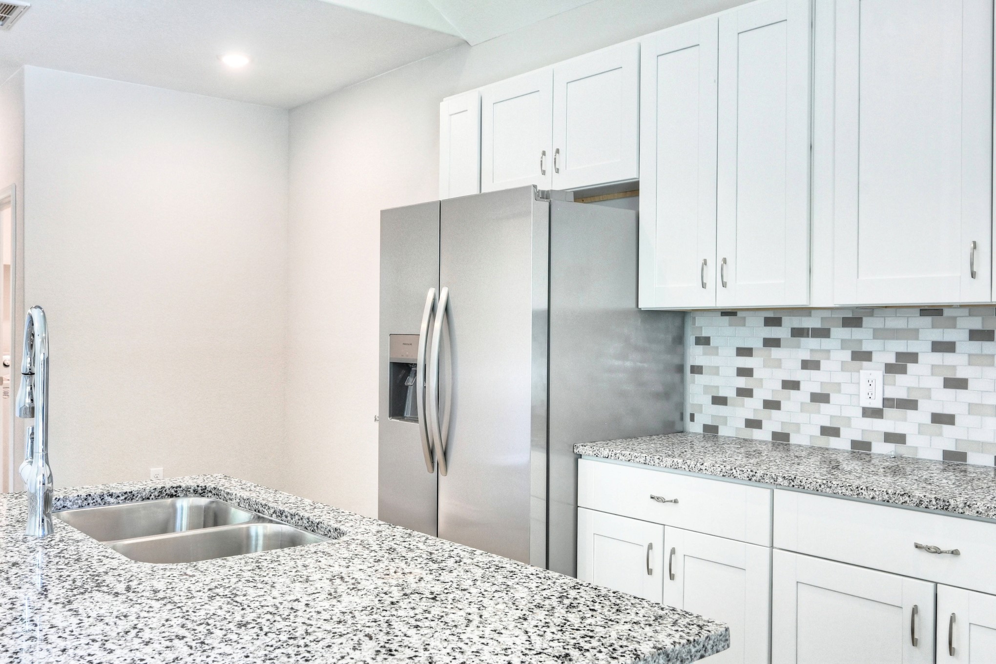 9810 Arbor Oak Willis, TX 77318 - Photo 14 of 43 a kitchen with granite countertop a sink stainless steel appliances and cabinets