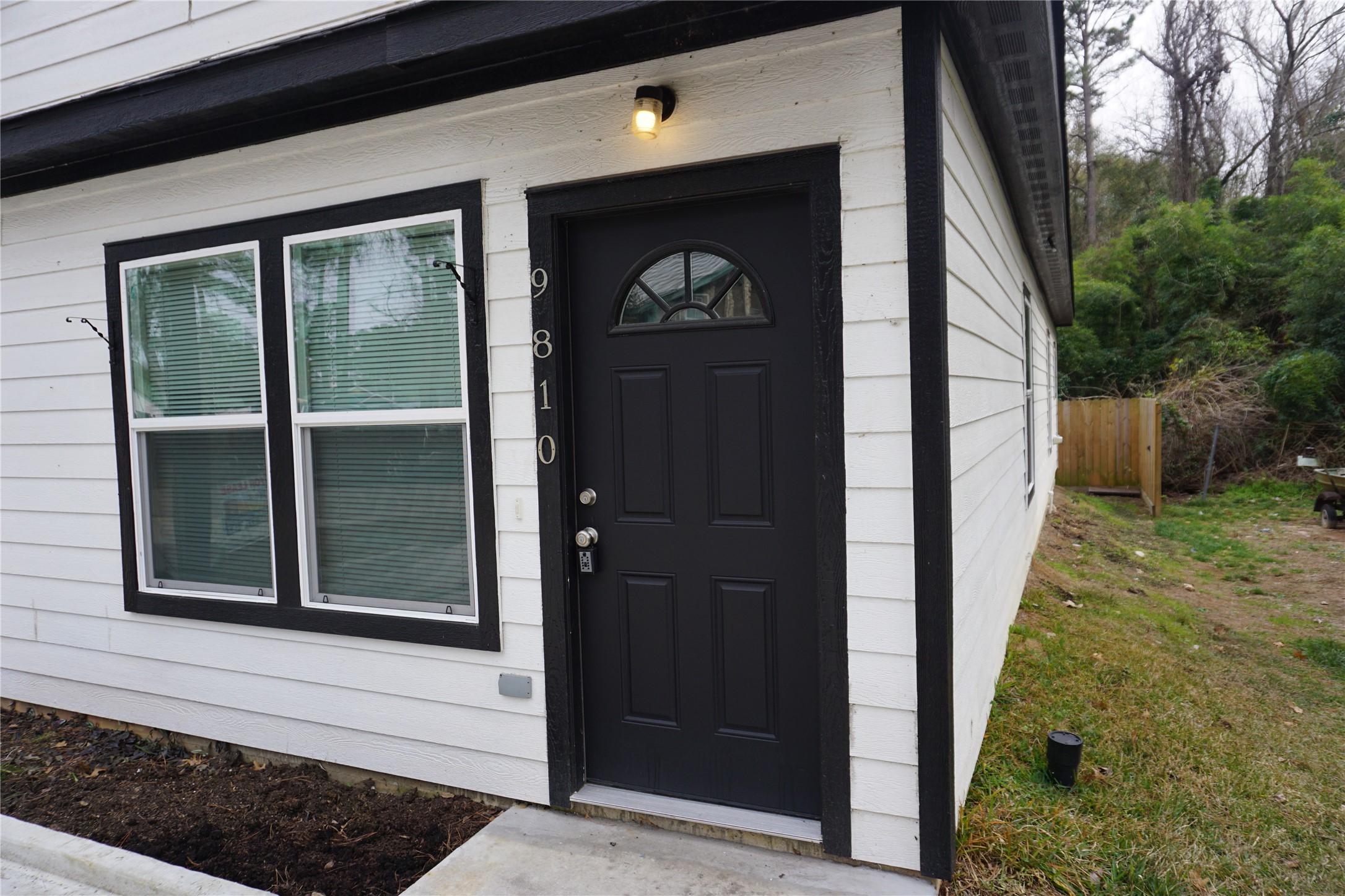 9810 Arbor Oak Willis, TX 77318 - Photo 2 of 43 a front view of a house with a yard