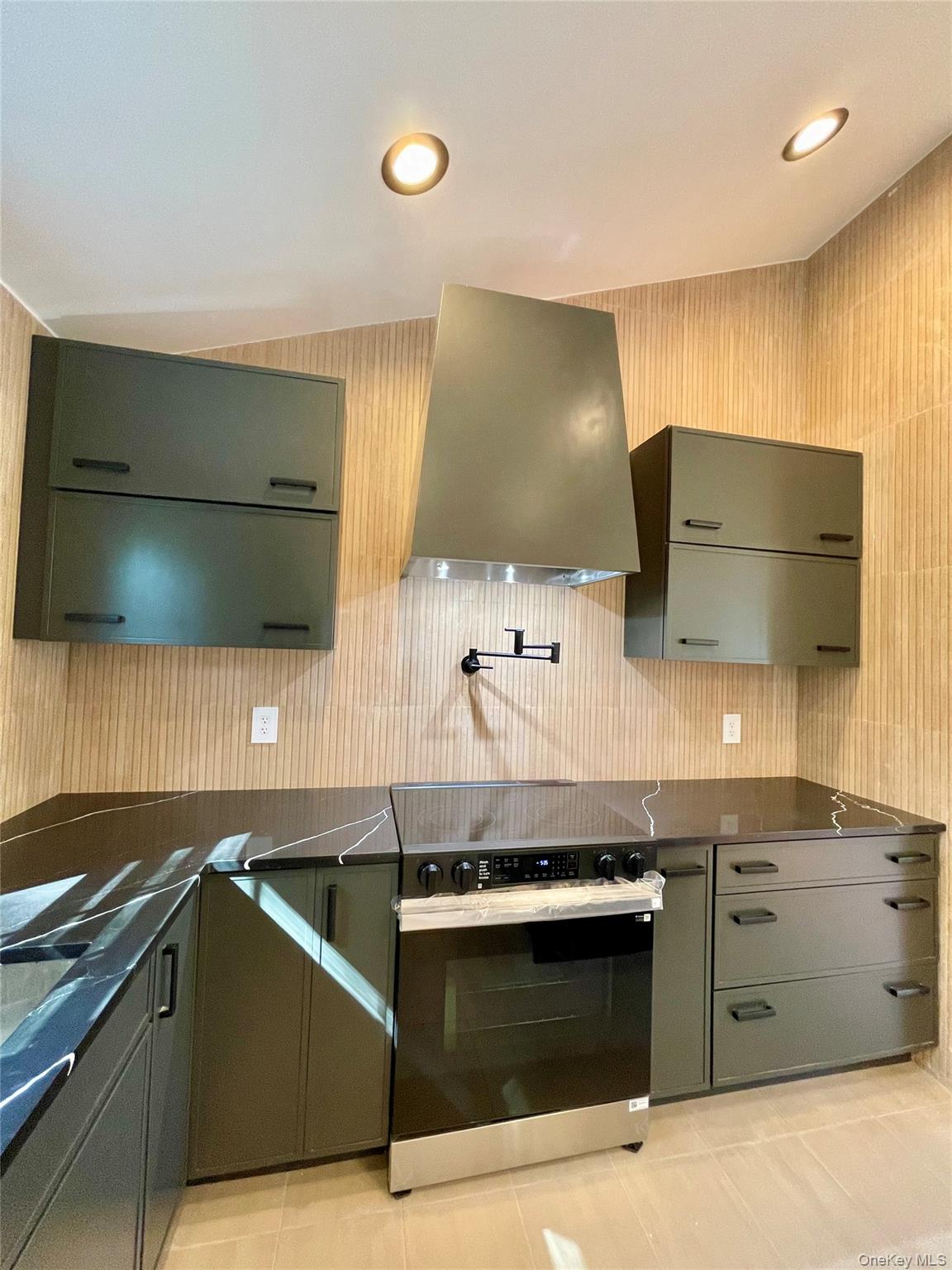 10 Frederick Middletown, NY 10941 - Photo 13 of 38 a kitchen with stainless steel appliances a stove and a microwave