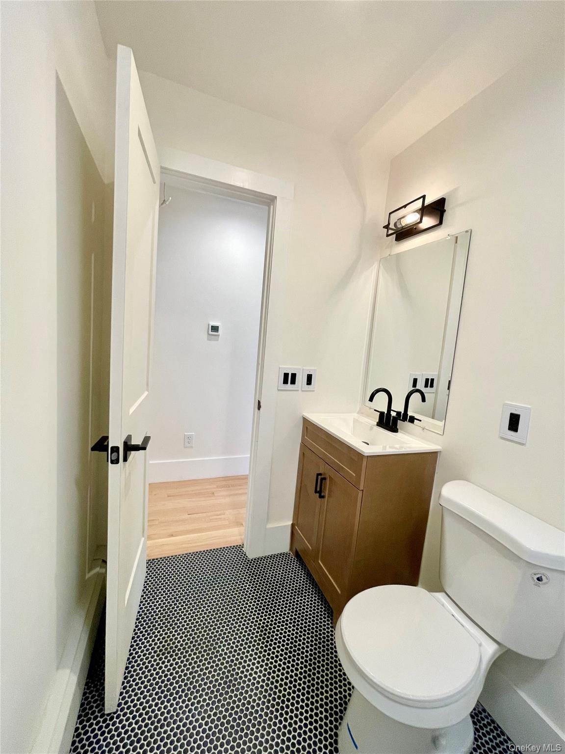 10 Frederick Middletown, NY 10941 - Photo 16 of 38 a white toilet sitting next to a bathroom sink