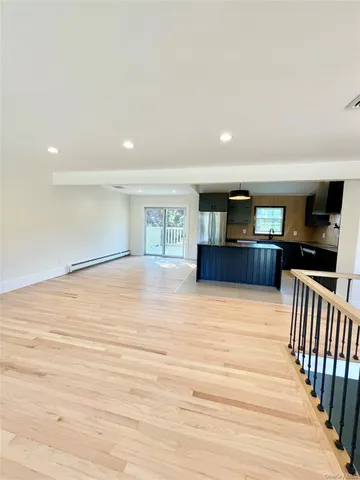 a lobby with furniture and a ceiling fan