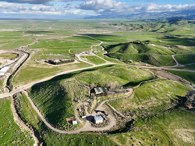 a view of a swimming pool with a yard