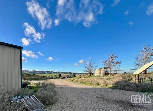 a view of a hallway with paintings on the wall