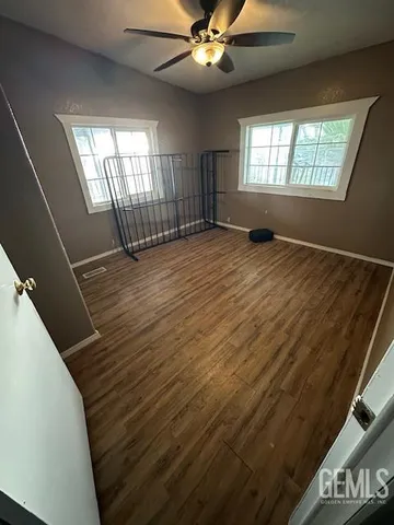 a view of kitchen and empty room